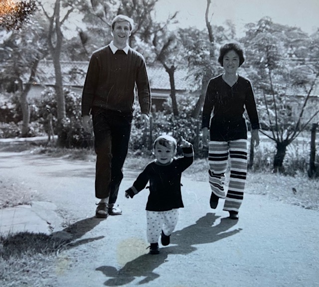 Victor Mair walking with his wife and young son